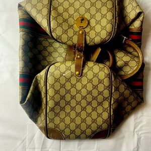 Gucci Duffle Bag.